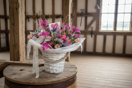 FRESH TULIP AND COLOURED FOLIAGE ARRANGEMENT IN LARGE BASKET
